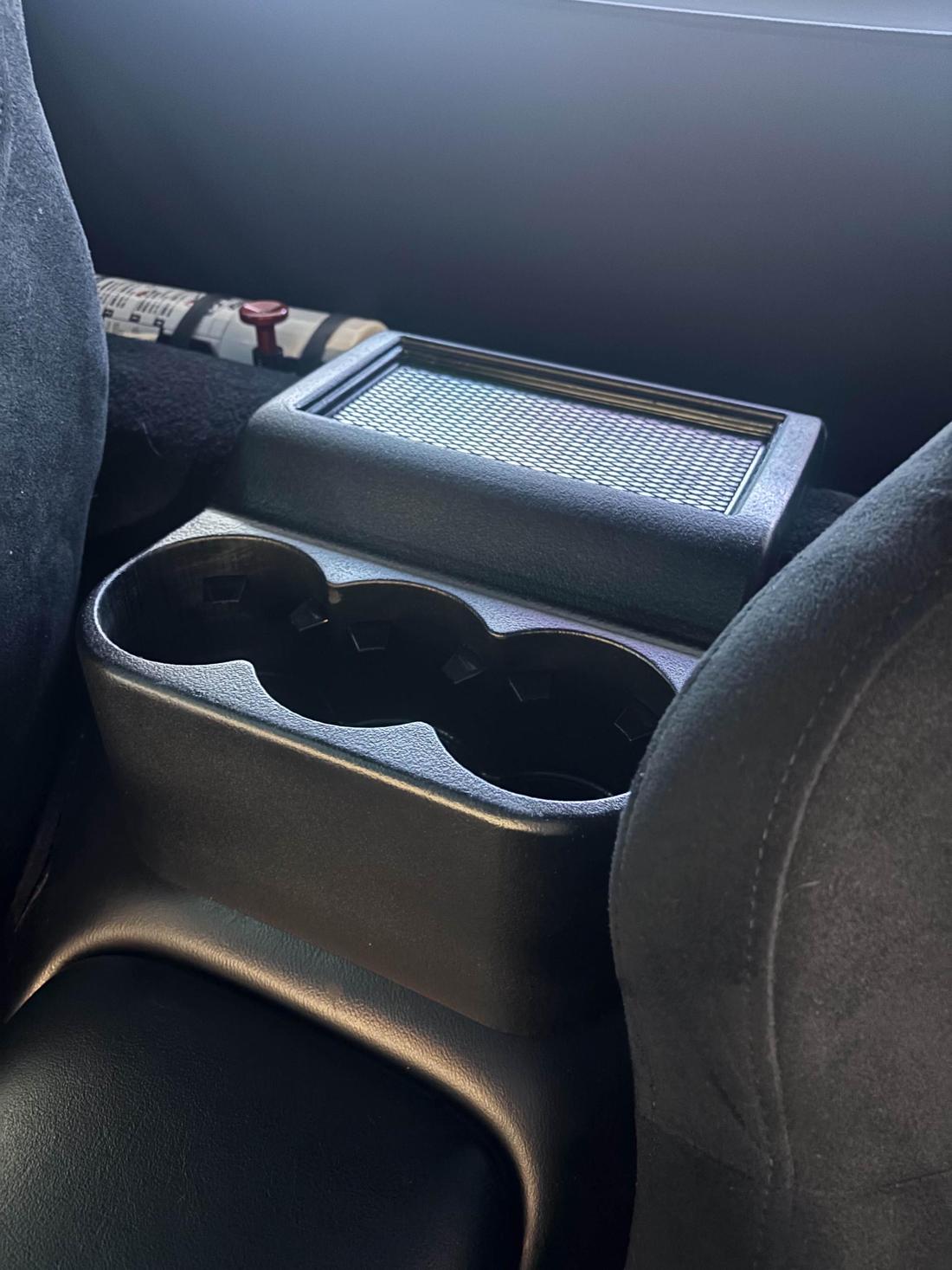 C5 cupholder mounted behind the seats