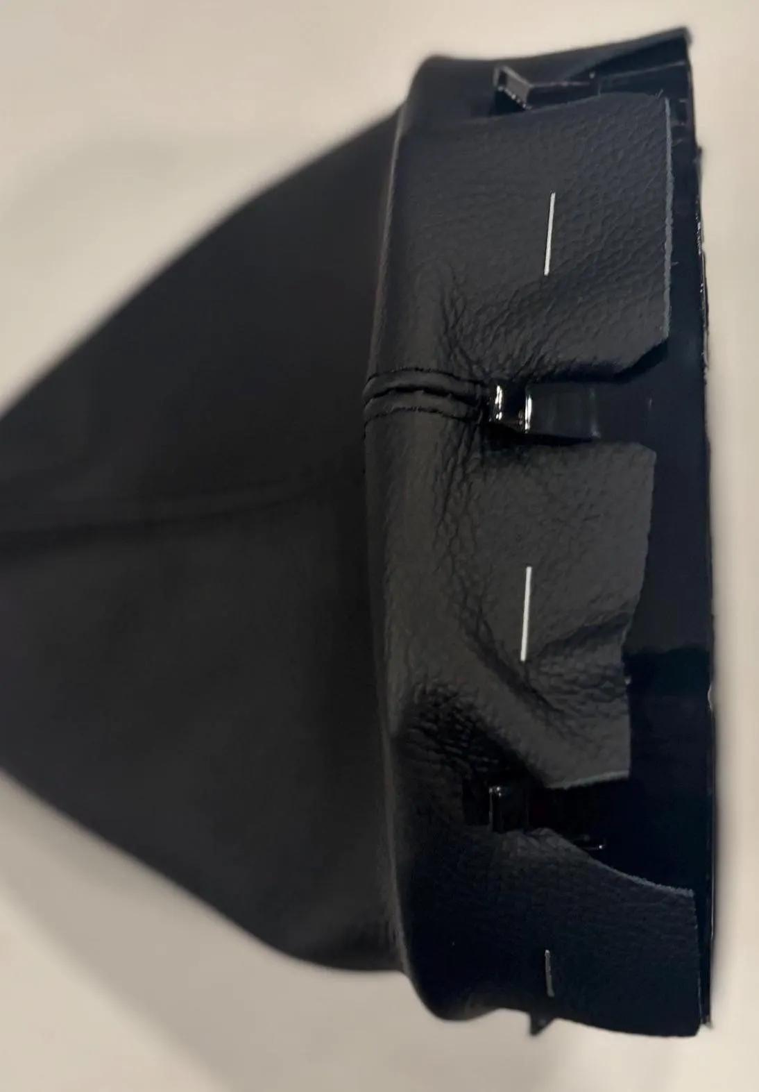 Boot stapled to the bracket, close-up