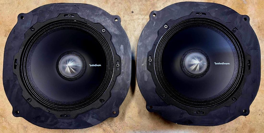 Two 8 inch speakers mounted in the adapters